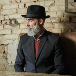 Czarny kapelusz fedora z surowymi krawędziami Filippo Moda