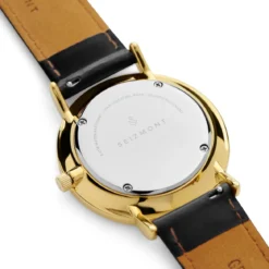 Moment | Zegarek elegancki minimalistyczny w kolorze złota z analogowym mechanizmem kwarcowym, tarczą w kolorze szampańskim & czarnym skórzanym paskiem